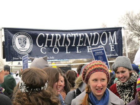 Students with Christendom College banner