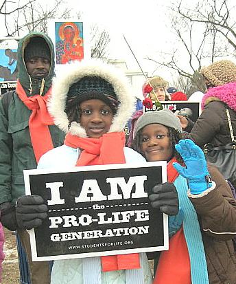 Two little African American girls with sign, 'I Am the Pro-Life Generation'