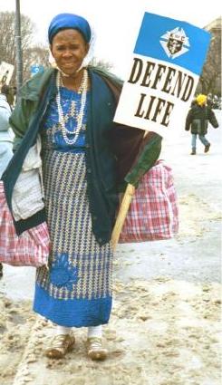 Woman with 'Defend Life' sign
