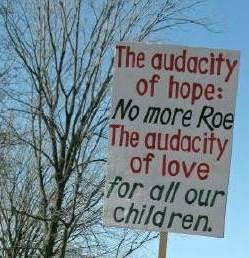 Sign at March for Life--'The audacity of hope: <em>No more Roe</em>/The audacity of love <em>for all our children.</em>'
