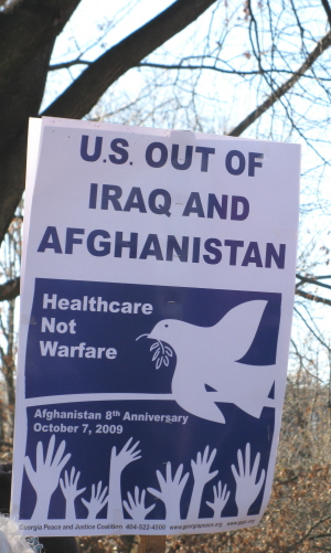 Sign proclaims:'U.S.Out of Iraq and Afghanistan/Healthcare Not Warfare'