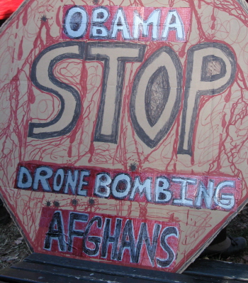 Sign says: 'Obama Stop Drone Bombing Afghans'