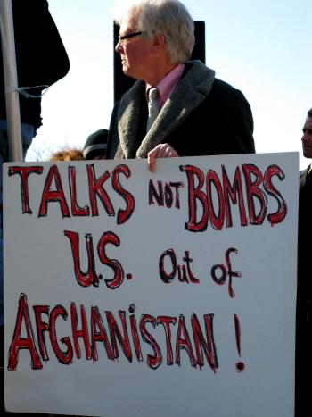Man with sign: 'Talks/Not Bombs/U.S. Out of Afghanistan!'