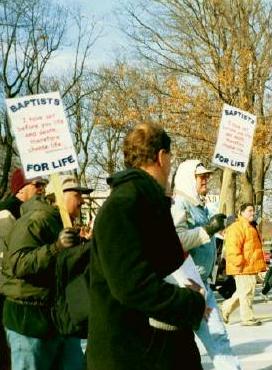 Marchers with Baptists for Life signs