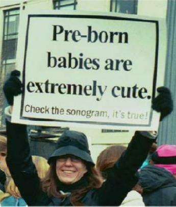 Woman with sign: 'Pre-born babies are extremely cute.'