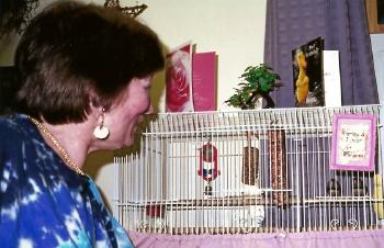 Resident views her caged finches