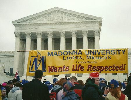 Banner at Supreme Court: 'Madonna University <em>Wants Life Respected!'</em>