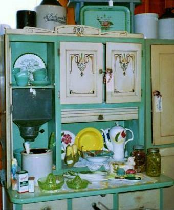 Hoosier cabinet with many kitchen collectibles