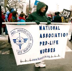 Nurse with banner: 'National Association of Pro-Life Nurses'