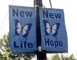 Twin blue banners with butterfly picture; one says 'New Life,' and the other 'New Hope'