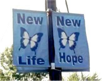 Twin blue banners with butterfly picture; 
one says 'New Life,' and the other 'New Hope'