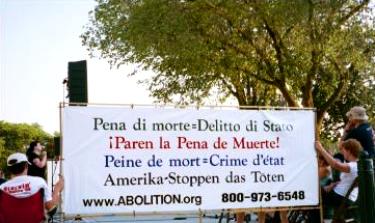 Banner with anti-death penalty slogans in Italian, Spanish, French, and German
