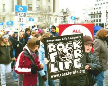 Boy with 'Rock for Life' sign