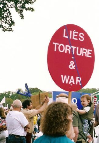 Sign at antiwar gathering demands an end to lies, torture, and war