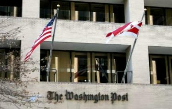 The <em>Washington Post</em> building, with flags' flying
