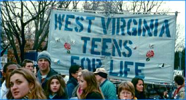 Marchers with West Virginia Teens for Life banner